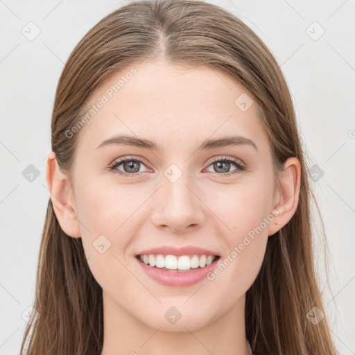 Joyful white young-adult female with long  brown hair and blue eyes