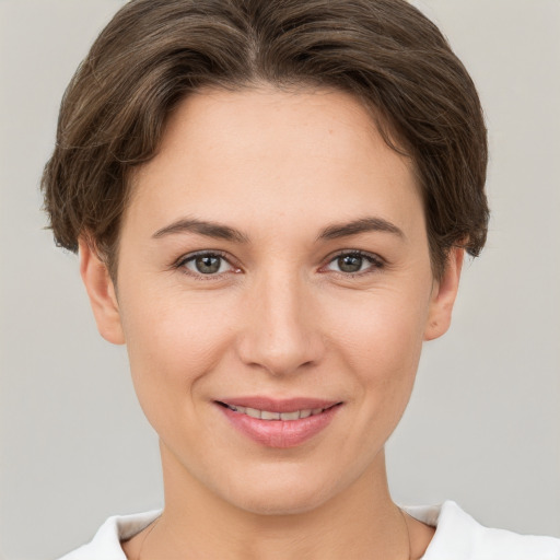 Joyful white young-adult female with short  brown hair and brown eyes