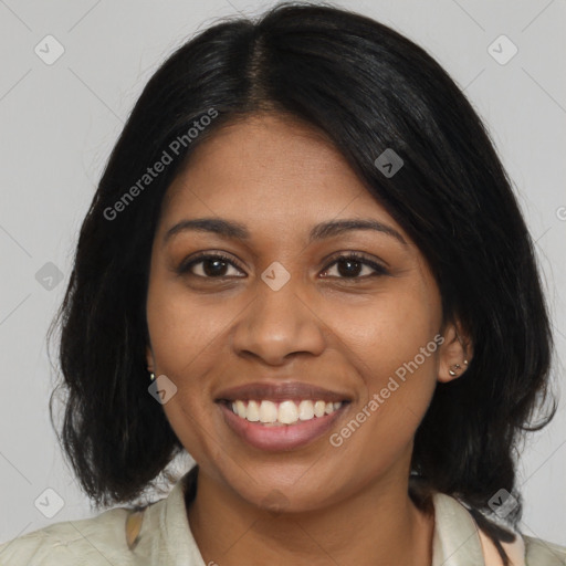 Joyful black young-adult female with medium  brown hair and brown eyes