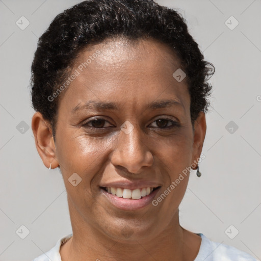 Joyful black adult female with short  brown hair and brown eyes