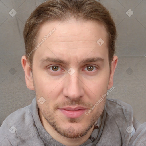 Joyful white adult male with short  brown hair and grey eyes