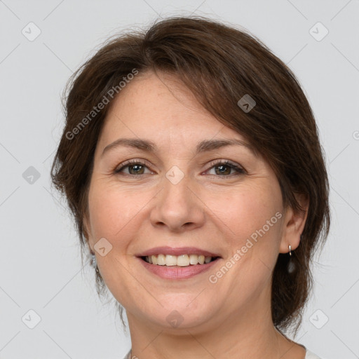 Joyful white adult female with medium  brown hair and brown eyes