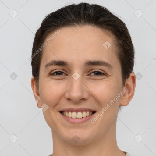 Joyful white young-adult female with short  brown hair and brown eyes