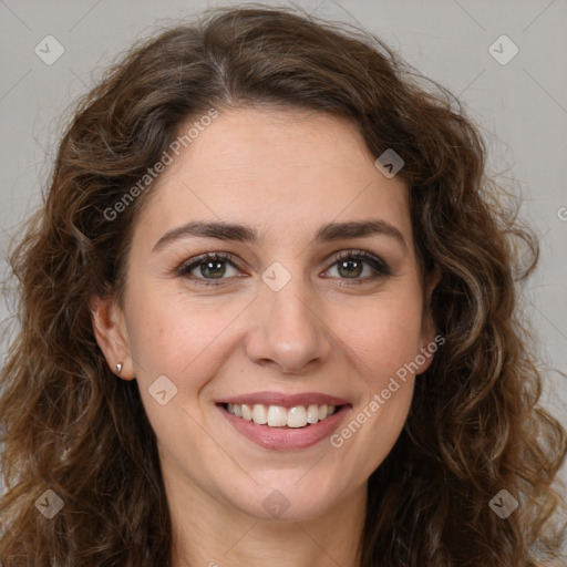 Joyful white young-adult female with long  brown hair and green eyes