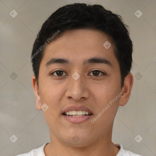 Joyful latino young-adult male with short  black hair and brown eyes