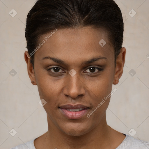 Joyful black young-adult female with short  brown hair and brown eyes