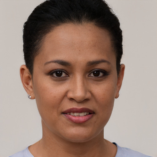 Joyful white young-adult female with short  brown hair and brown eyes