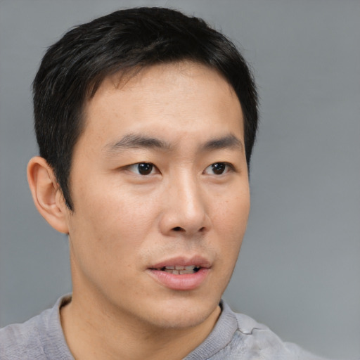 Neutral asian young-adult male with short  brown hair and brown eyes