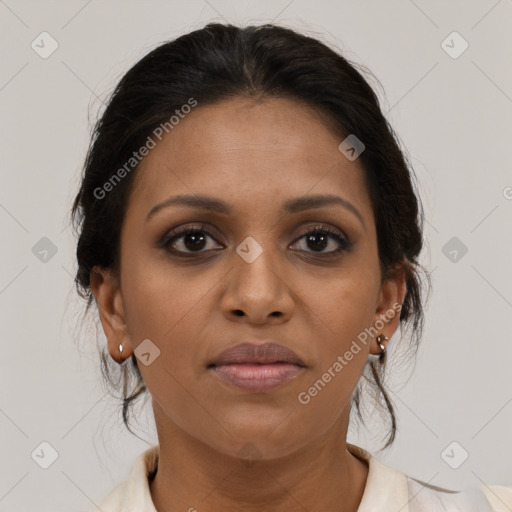 Joyful black young-adult female with medium  brown hair and brown eyes