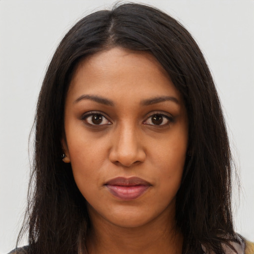 Neutral black young-adult female with long  brown hair and brown eyes