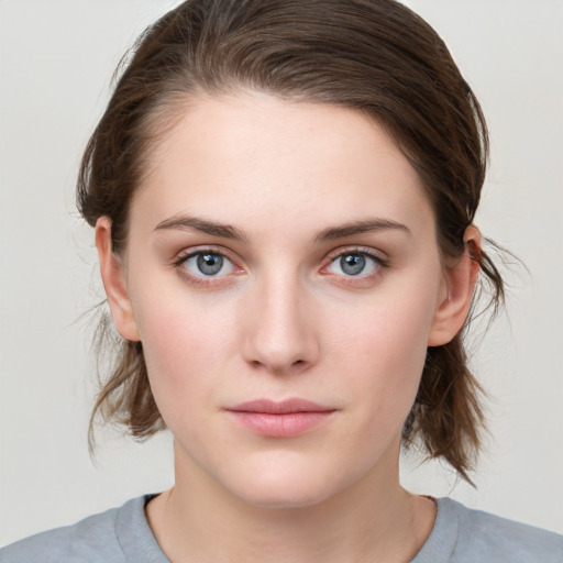 Neutral white young-adult female with medium  brown hair and grey eyes