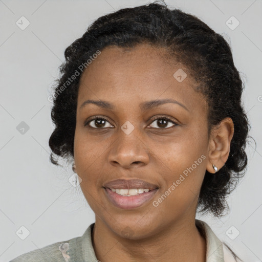 Joyful black adult female with short  brown hair and brown eyes