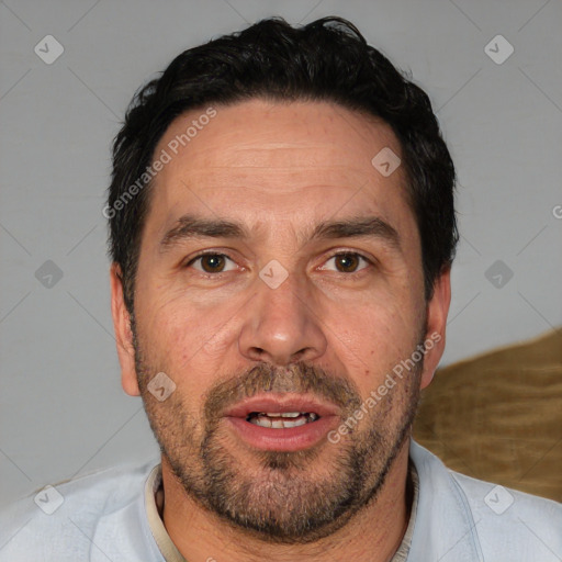 Joyful white adult male with short  black hair and brown eyes