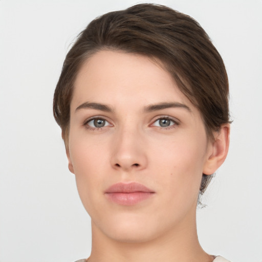 Neutral white young-adult female with short  brown hair and brown eyes