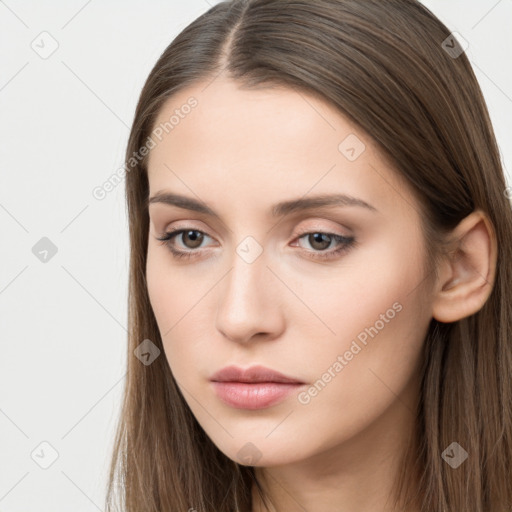 Neutral white young-adult female with long  brown hair and brown eyes