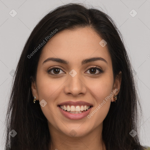 Joyful latino young-adult female with long  brown hair and brown eyes