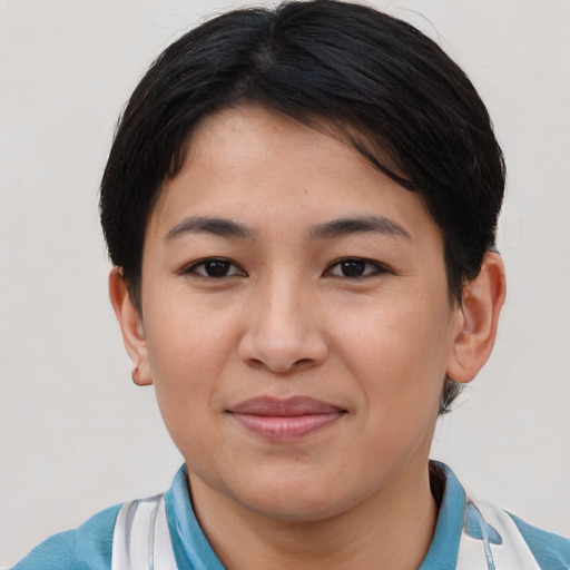 Joyful asian young-adult female with short  brown hair and brown eyes