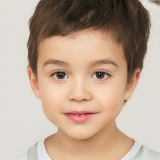 Joyful white child male with short  brown hair and brown eyes