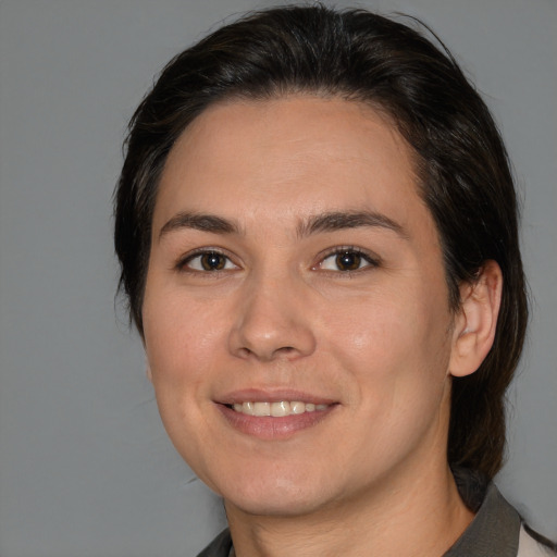 Joyful white young-adult female with medium  brown hair and brown eyes