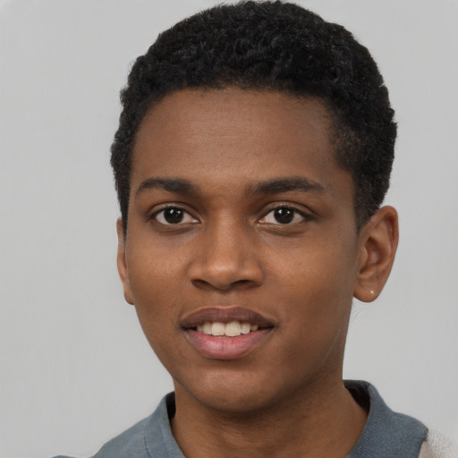 Joyful black young-adult male with short  black hair and brown eyes