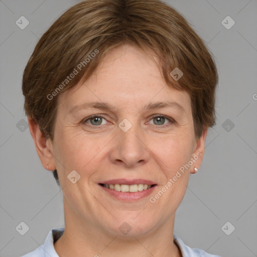 Joyful white adult female with short  brown hair and grey eyes