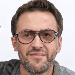 Joyful white adult male with short  brown hair and grey eyes