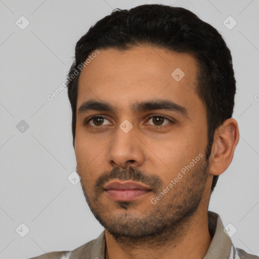 Neutral latino young-adult male with short  black hair and brown eyes