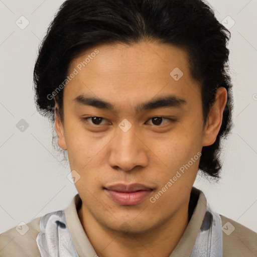 Joyful latino young-adult male with short  brown hair and brown eyes