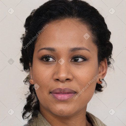 Joyful black young-adult female with medium  brown hair and brown eyes