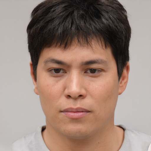 Neutral asian young-adult male with short  brown hair and brown eyes