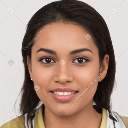 Joyful latino young-adult female with long  brown hair and brown eyes