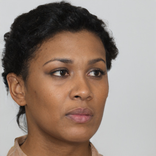 Neutral black young-adult female with short  brown hair and brown eyes