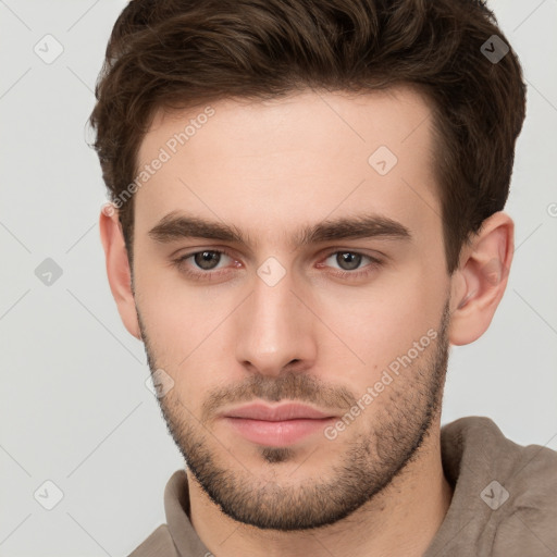 Neutral white young-adult male with short  brown hair and brown eyes