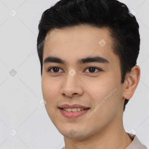 Joyful latino young-adult male with short  black hair and brown eyes