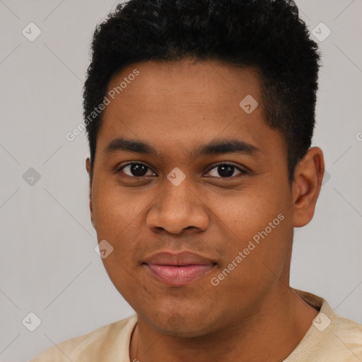 Joyful black young-adult male with short  black hair and brown eyes