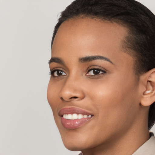 Joyful latino young-adult female with short  black hair and brown eyes