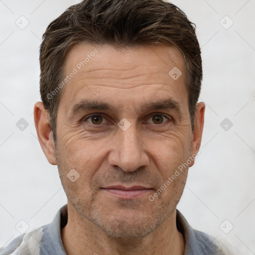 Joyful white adult male with short  brown hair and brown eyes