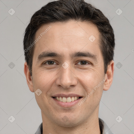 Joyful white young-adult male with short  brown hair and brown eyes