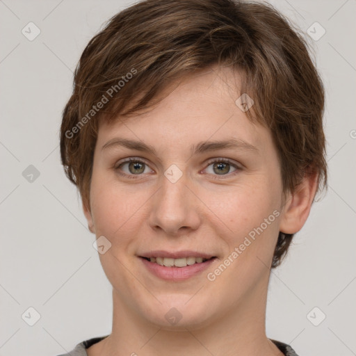 Joyful white young-adult female with short  brown hair and grey eyes