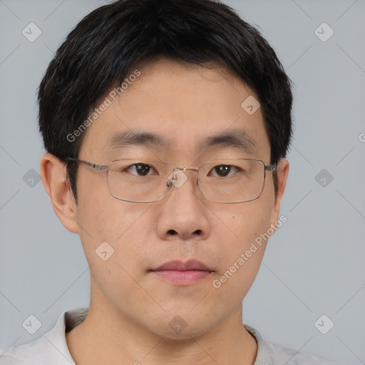 Neutral asian young-adult male with short  brown hair and brown eyes