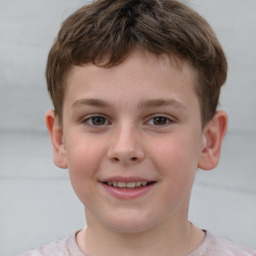 Joyful white child male with short  brown hair and brown eyes