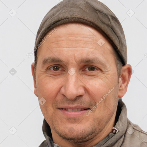 Joyful white adult male with short  brown hair and brown eyes