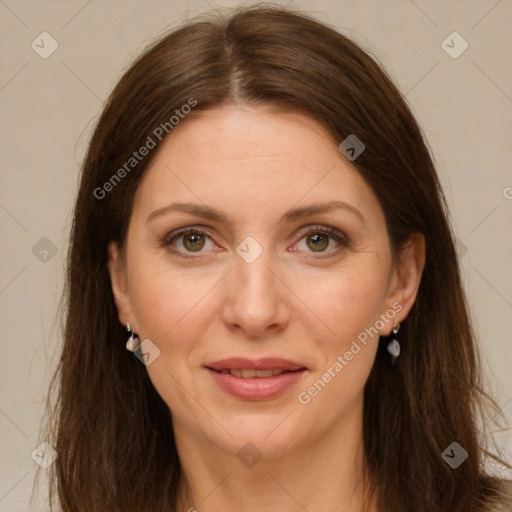 Joyful white adult female with long  brown hair and grey eyes