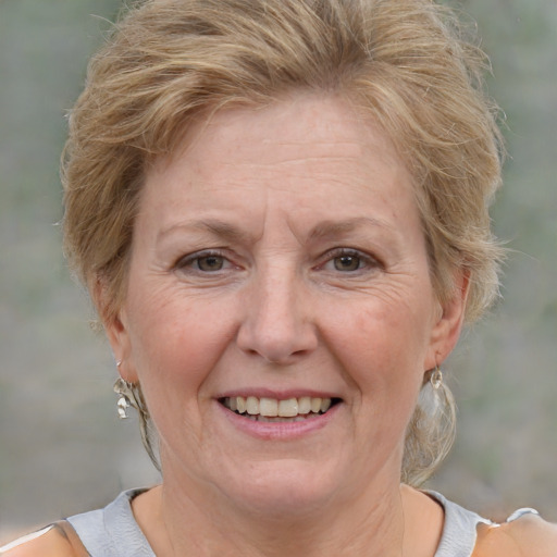 Joyful white adult female with short  brown hair and grey eyes