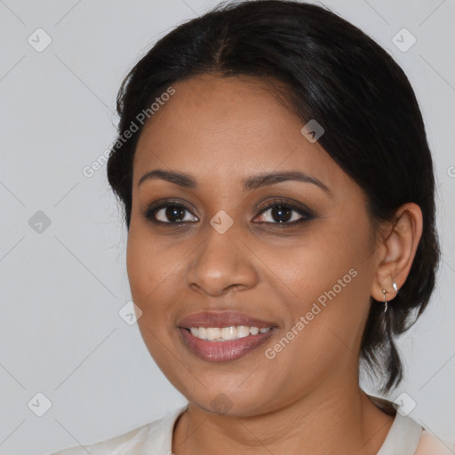 Joyful latino young-adult female with medium  black hair and brown eyes