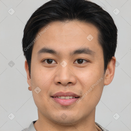 Joyful asian young-adult male with short  brown hair and brown eyes