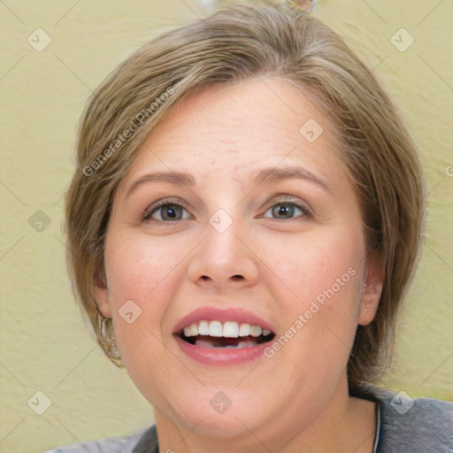 Joyful white adult female with medium  brown hair and grey eyes