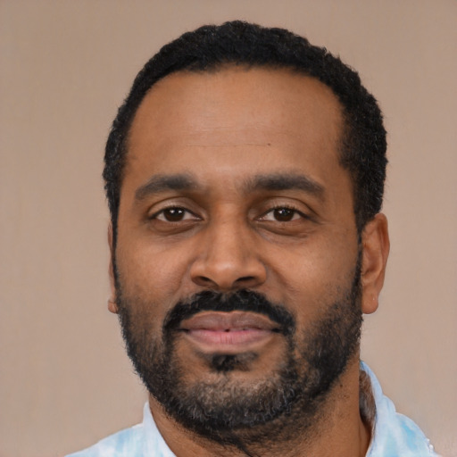 Neutral latino adult male with short  black hair and brown eyes