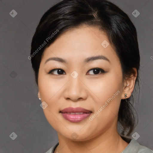 Joyful asian young-adult female with medium  black hair and brown eyes