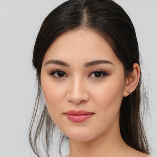 Joyful asian young-adult female with medium  brown hair and brown eyes